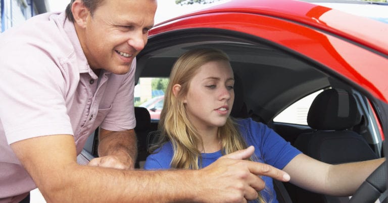 girl receiving learners permit test