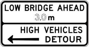 Low bridge ahead sign to warn high vehicles.