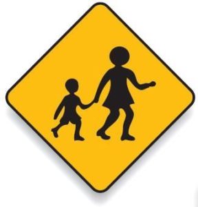 Children's crossing road sign commonly found in school zones.