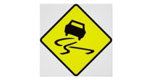 Slippery when wet traffic sign.